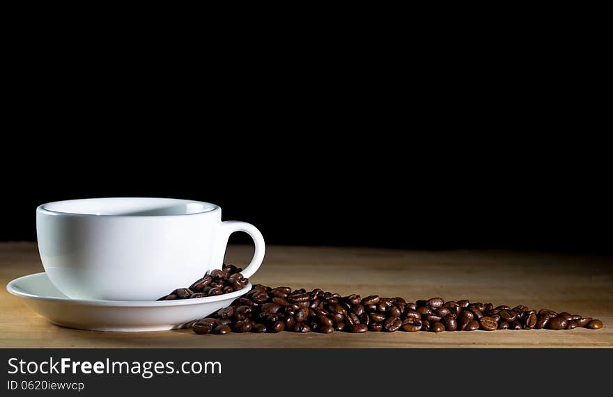 Cup of coffee on black background