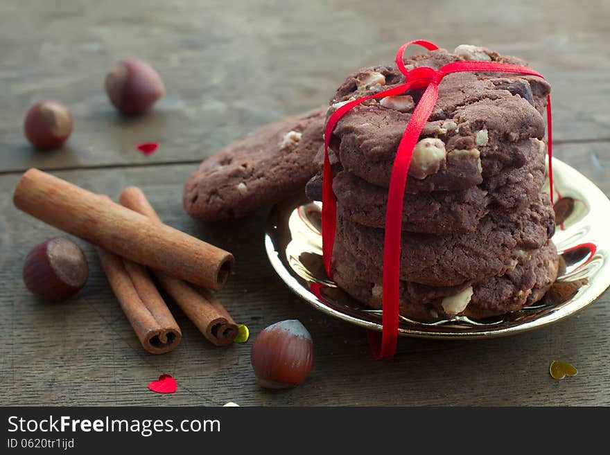 Cookies and nuts on a gold plate