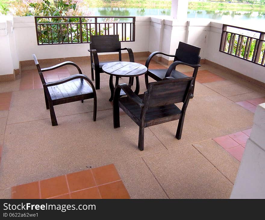 The balcony seating decorated with wooden furnitures. The balcony seating decorated with wooden furnitures.