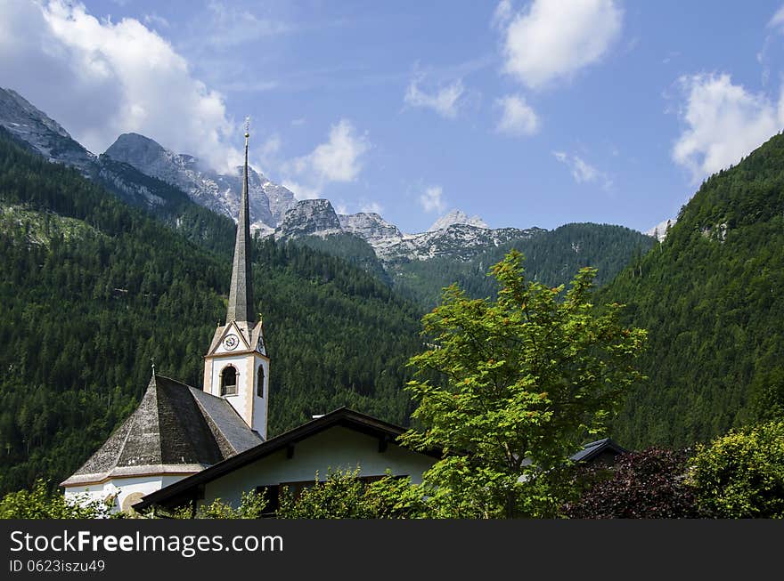 Church with view of the Alps mountains in the background; Austria