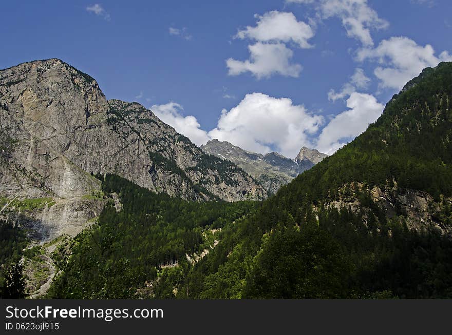 Austrian Landscape Of The Alps Mountains With Two Peaks