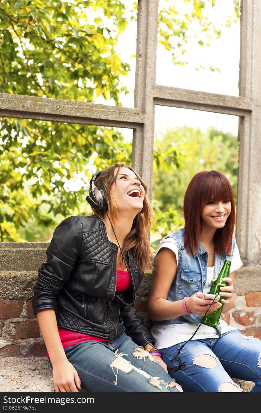 Happy girls-girls relax with music