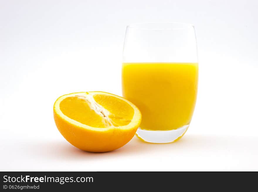 Glass of orange juice and orange slice