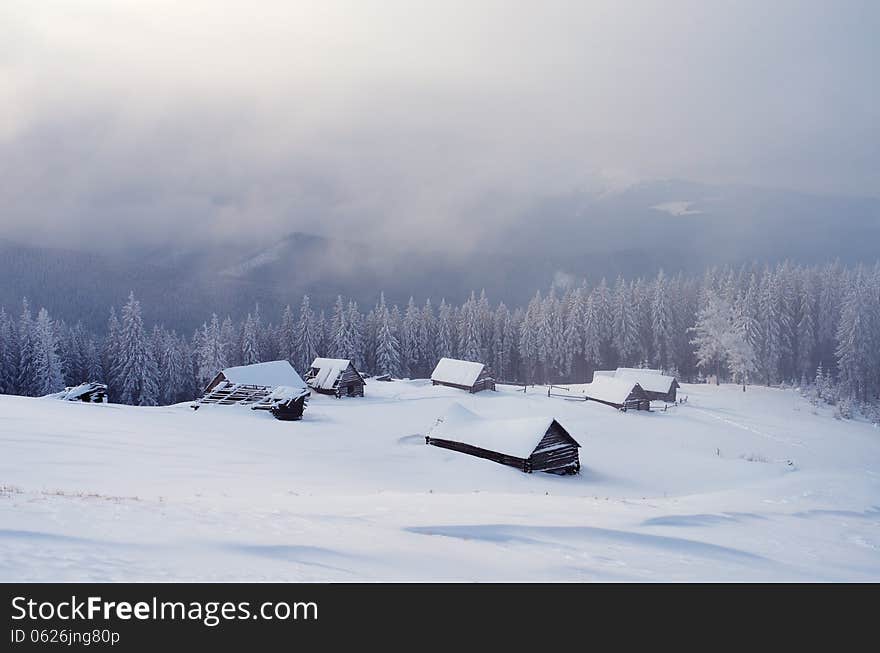 Winter landscape with snow-covered mountain villages. Carpathians, Ukraine