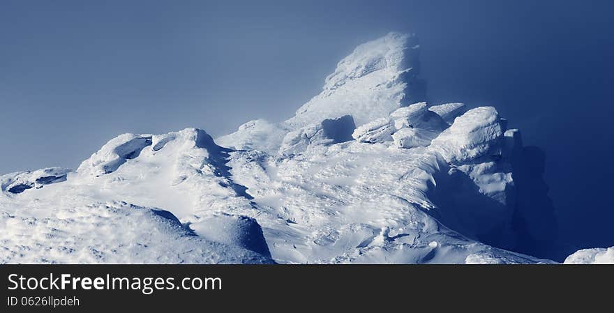 Landscape panorama the top of the mountain in winter fog. Carpathian mountains, Ukraine. Landscape panorama the top of the mountain in winter fog. Carpathian mountains, Ukraine