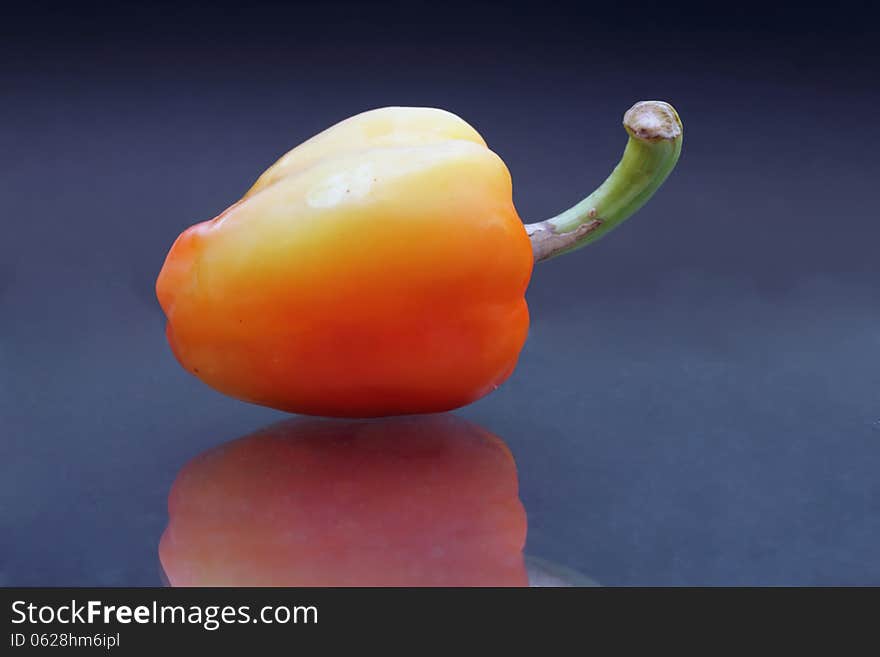 Red peppers on a dark background