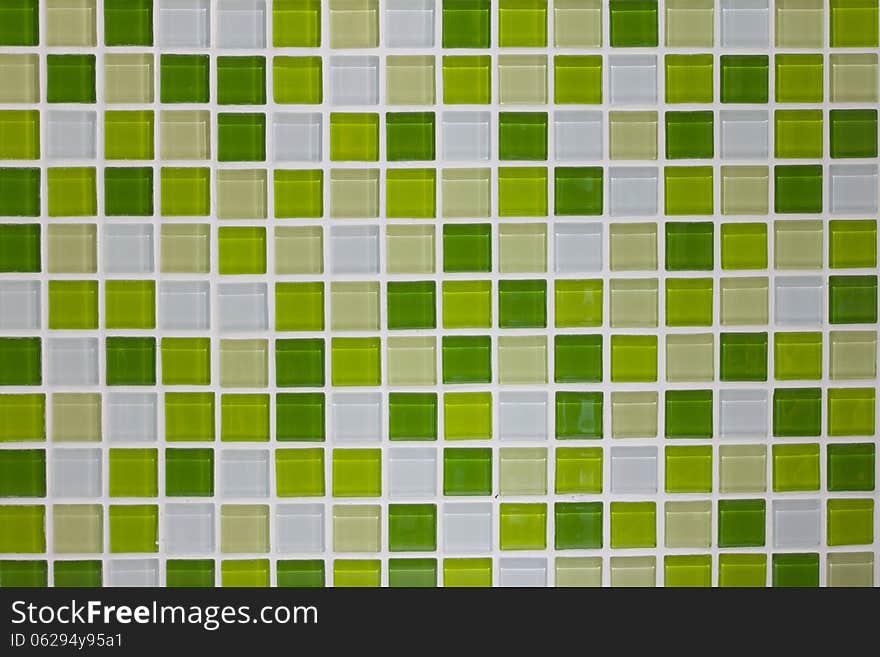 Green glass mosaic tiles wall in the kitchen. Green glass mosaic tiles wall in the kitchen