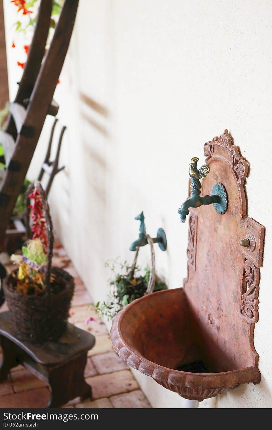 Traditional tap and sink setting