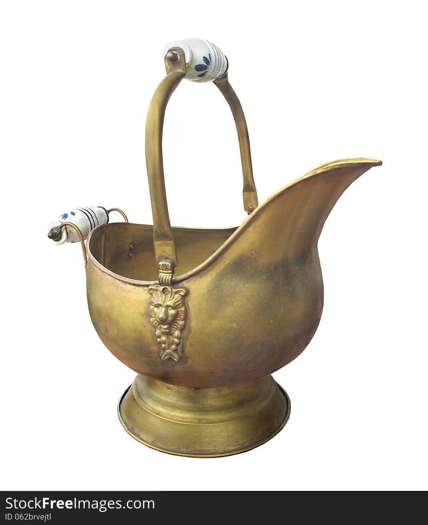 Antique brass coal scuttle isolated.