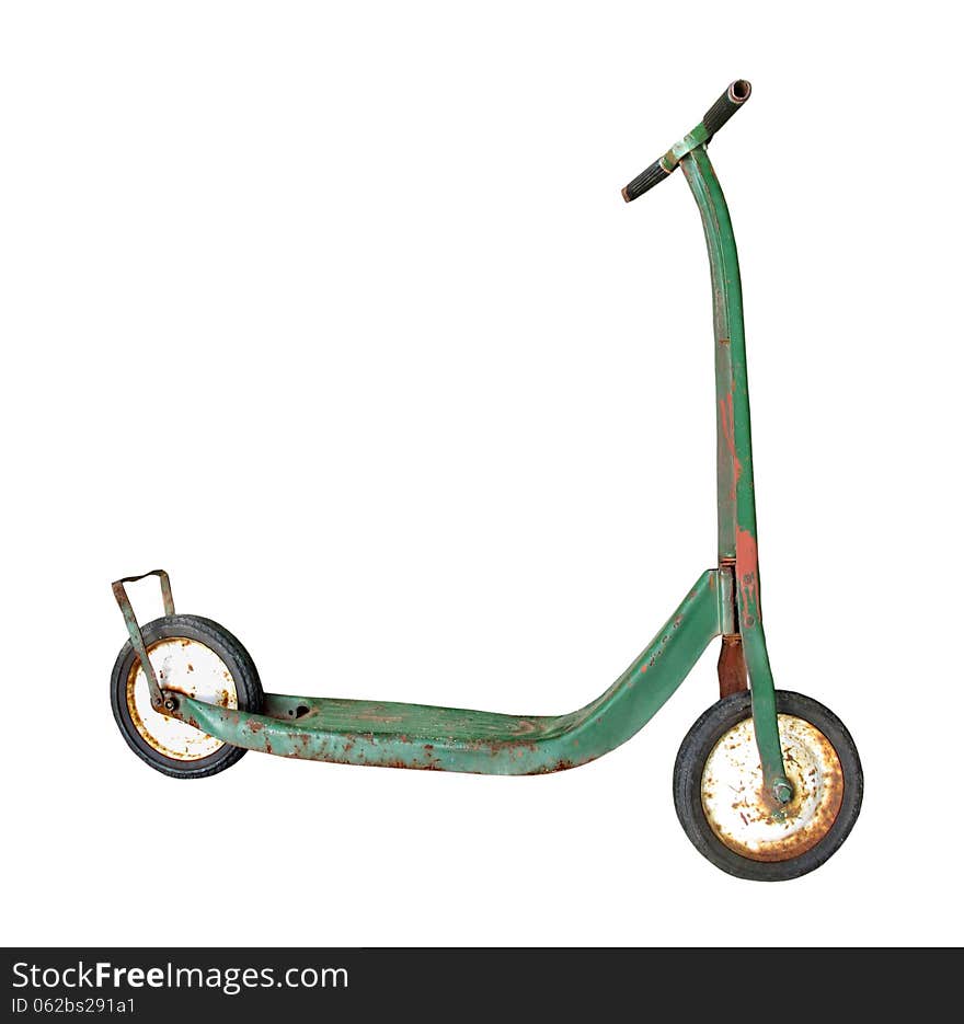 Old, worn, and weathered, green child’s push scooter. Isolated on white. Old, worn, and weathered, green child’s push scooter. Isolated on white.