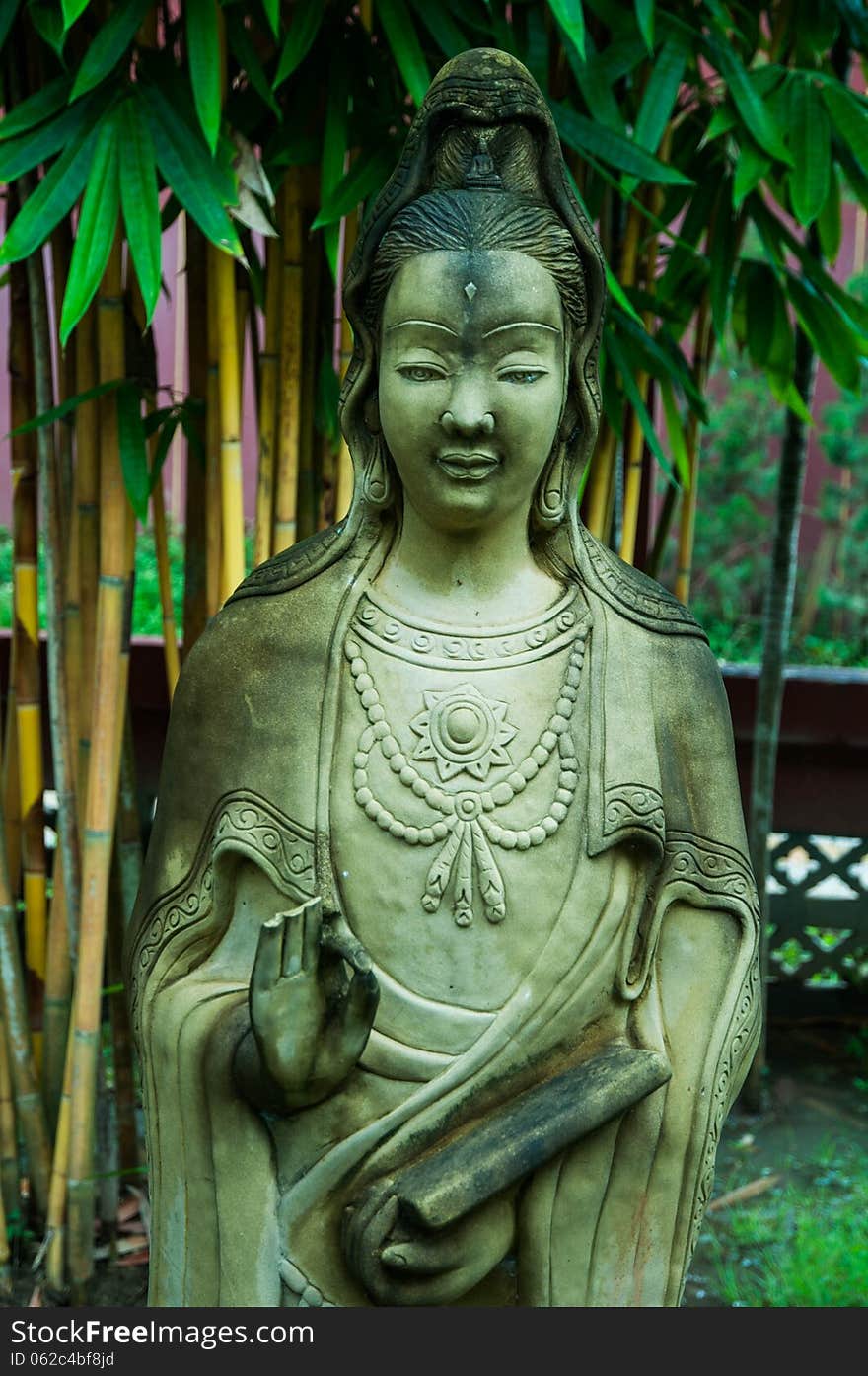 Statue of a woman in Thailand temple