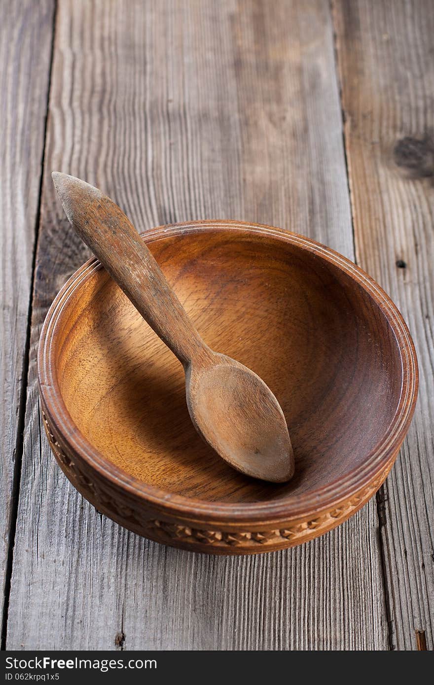 Wooden spoon on a wooden background