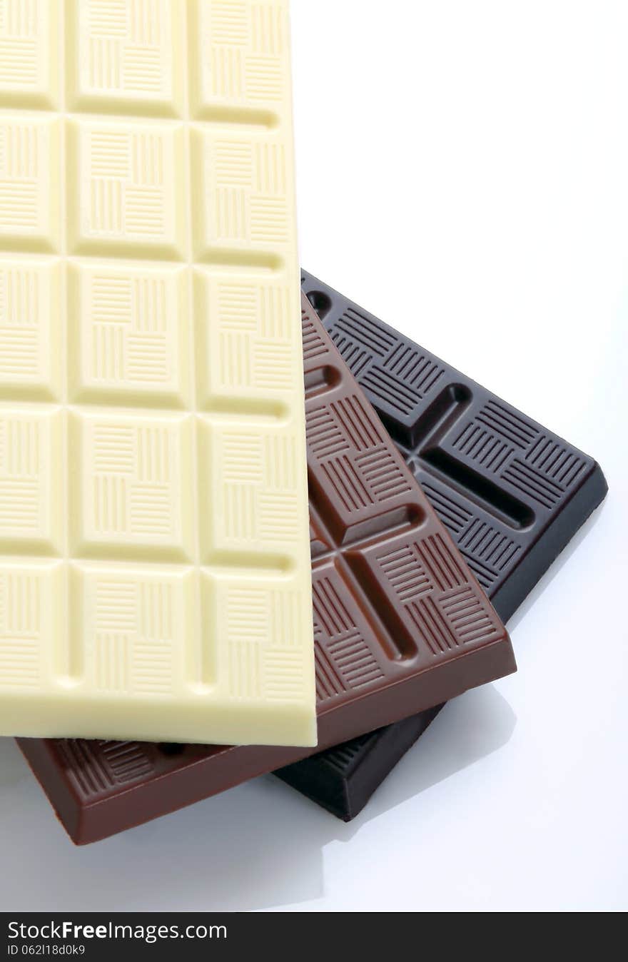 Chocolate bars on white background with overhead shot. Chocolate bars on white background with overhead shot