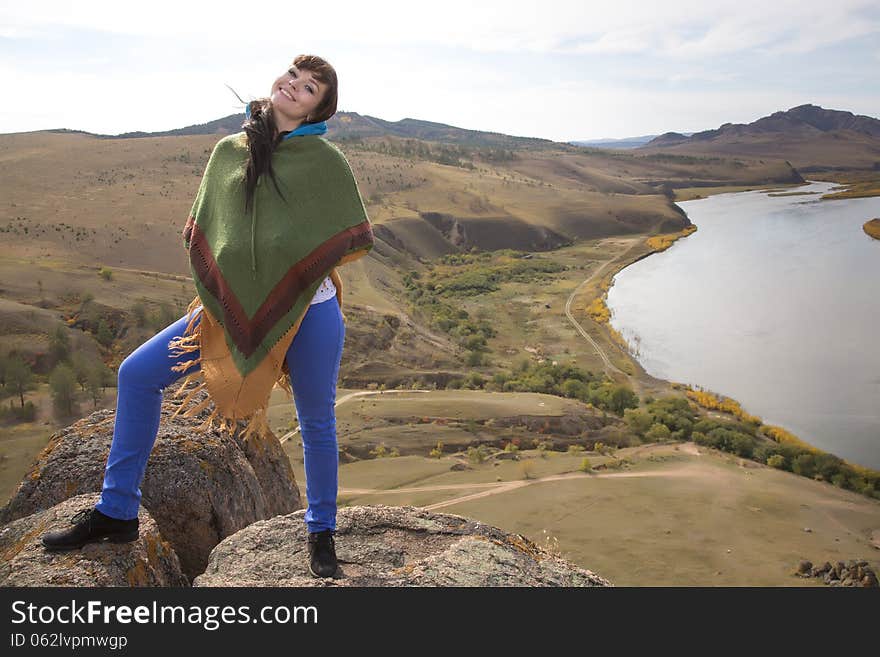 Woman on a rock in the mountains