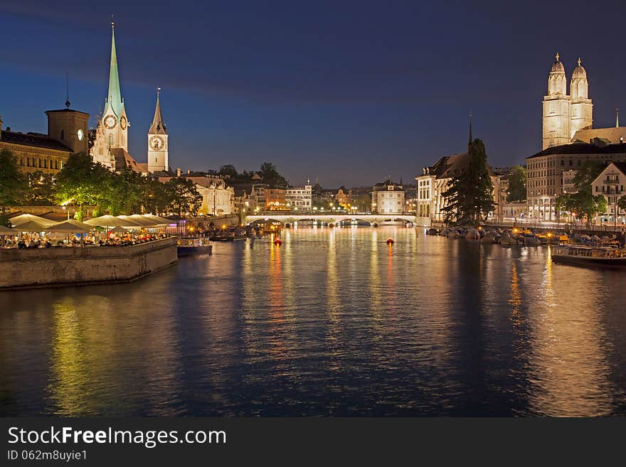 Summer Night in Zurich, Switzerland. View from the Quaibrücke bridge towards the Münsterbrücke bridge.