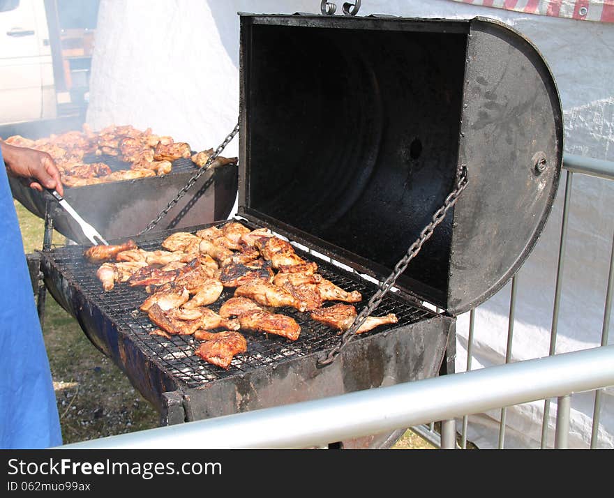 A Large Barbeque Cooking Lots of Chicken Portions. A Large Barbeque Cooking Lots of Chicken Portions.