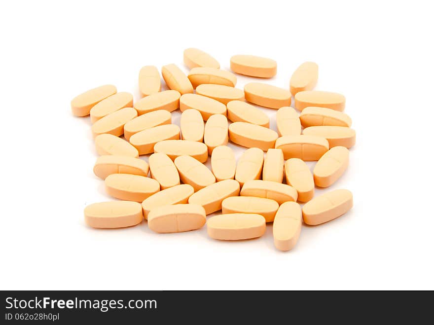 Vitamin pills on a white background