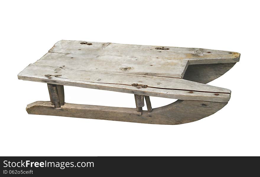 Old child’s wooden sled isolated