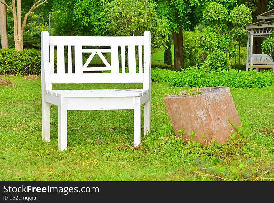 White bench for relax in garden