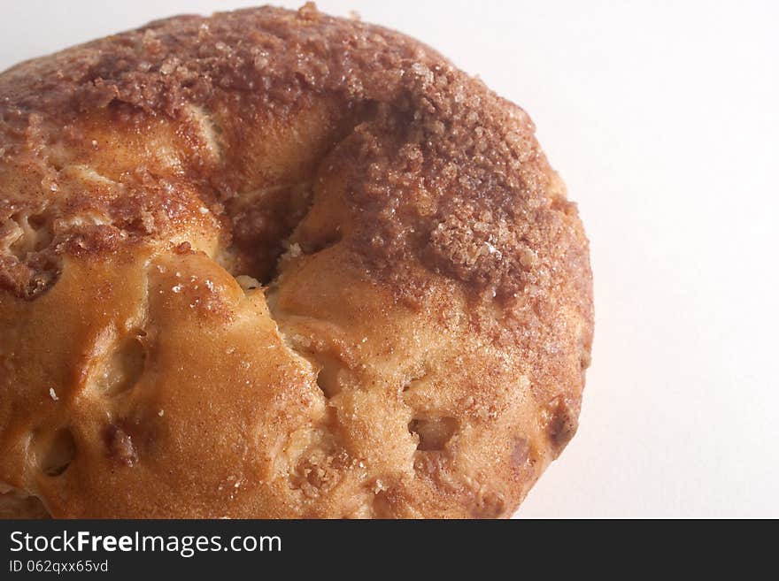 Single sweet tasty cinnamon bagel closeup