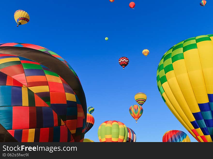 Colorful hot air balloons against blue sky