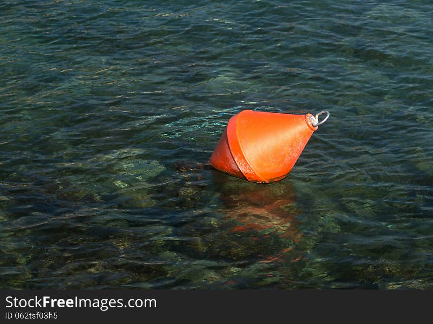 Red float in the sea. Red float in the sea