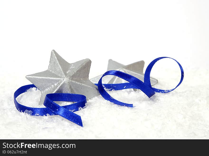 Silver stars with the blue ribbon on the white background