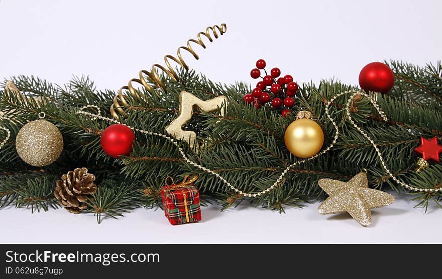 Christmas decoration with the twigs of the spruce and baubles