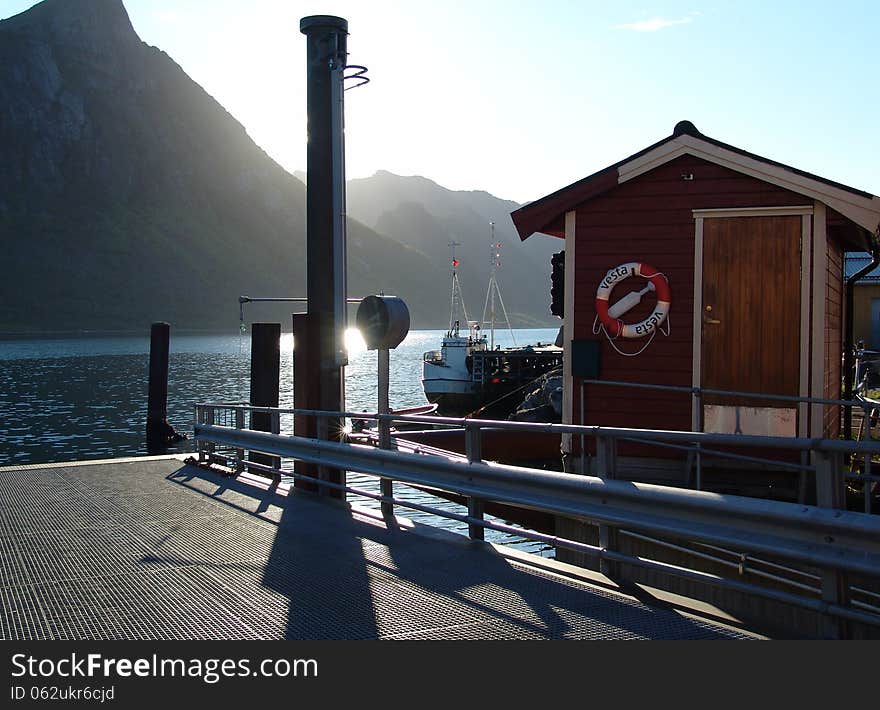 The ferry mooring in the Norwegian fjord. The ferry mooring in the Norwegian fjord