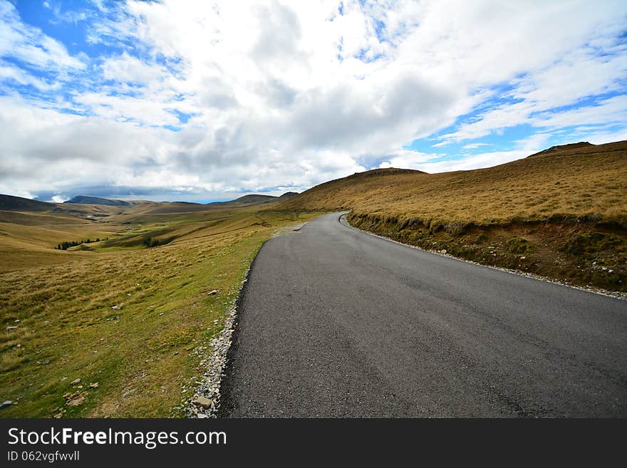 Paved road to the Sphinx from the Bucegi mountains, Romania, Europe. Paved road to the Sphinx from the Bucegi mountains, Romania, Europe.