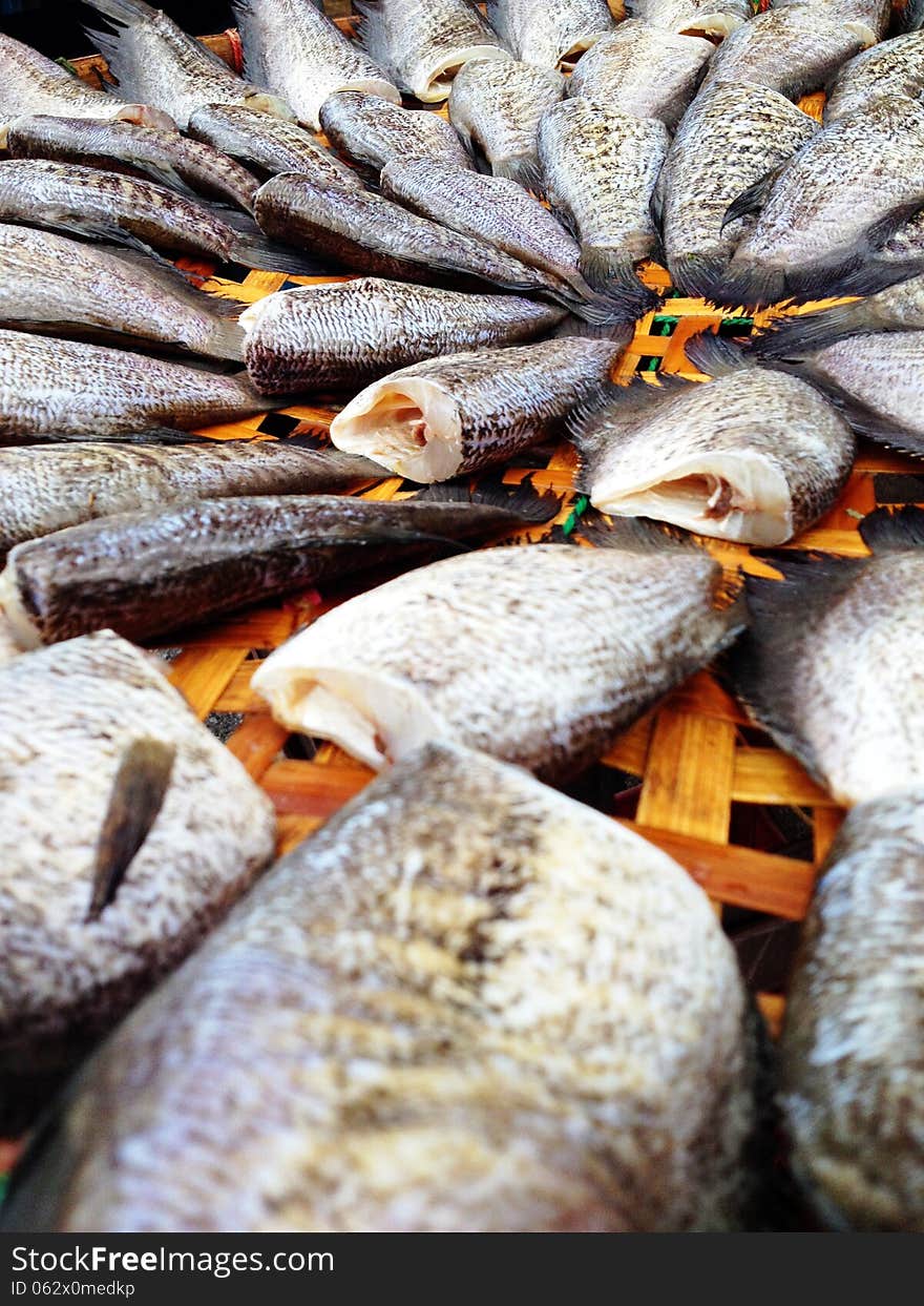 Drying snakeskin gourami fishes in local market, Thailand