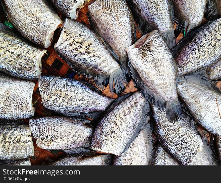 Drying snakeskin gourami fishes in local market, Thailand