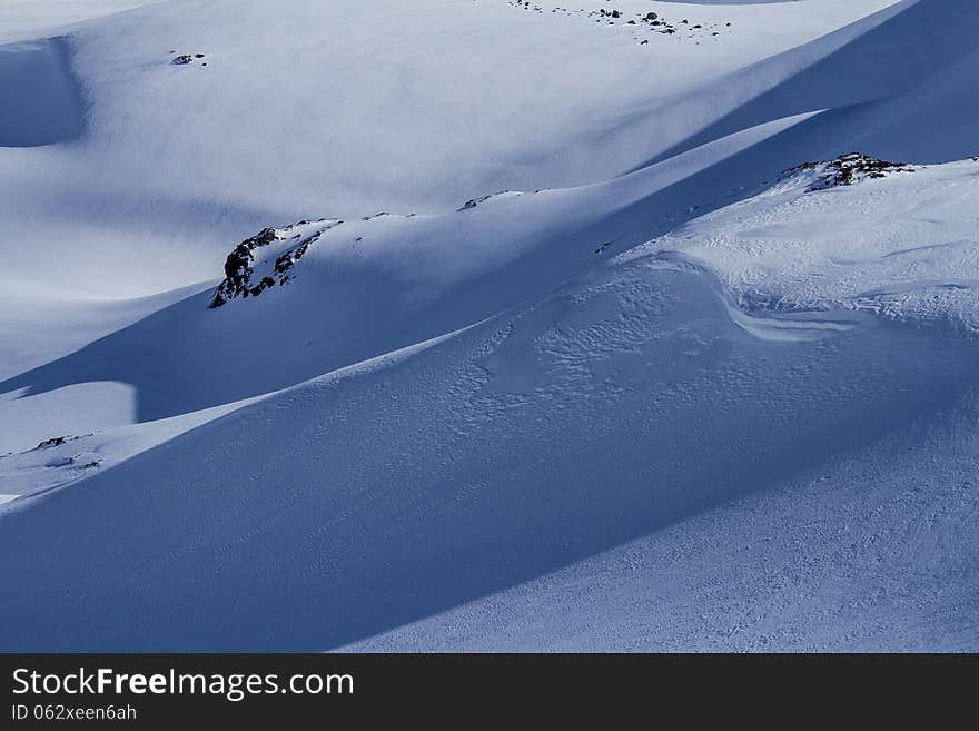 Snow and shadows on the mountain slop. Chile. Snow and shadows on the mountain slop. Chile