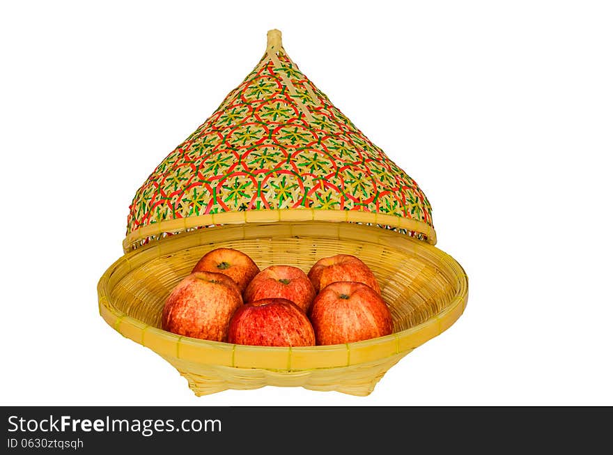 Apples in basket and lid on white background