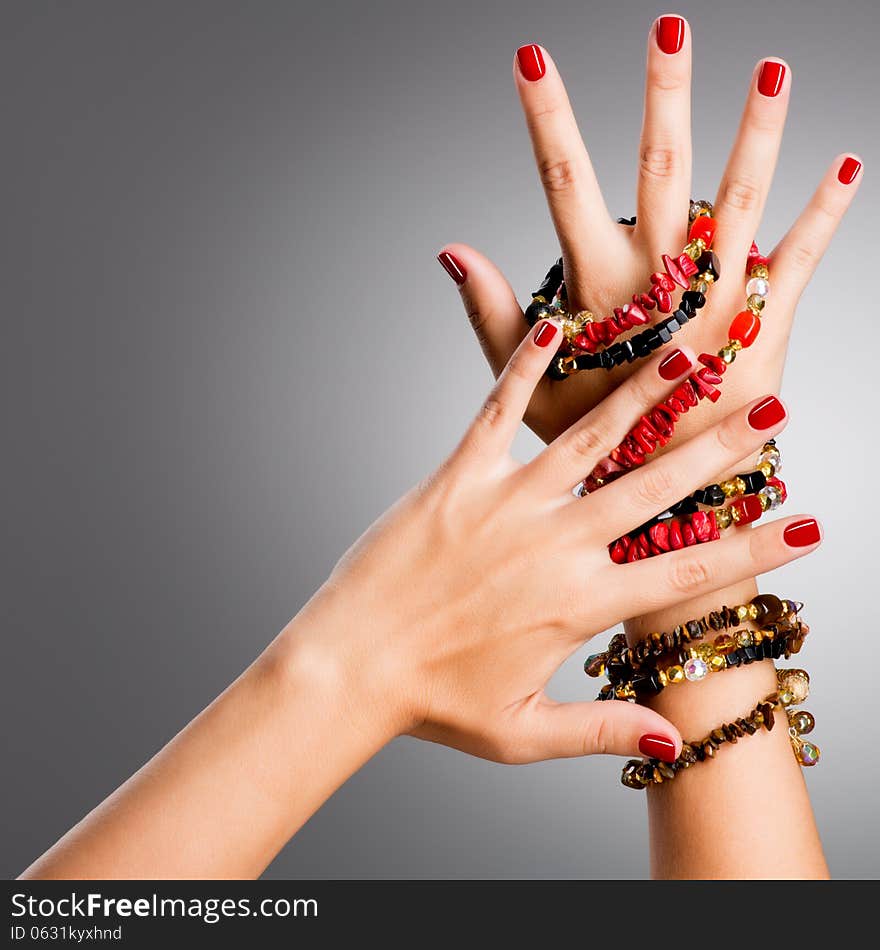 Closeup photo of a female hands with red nails