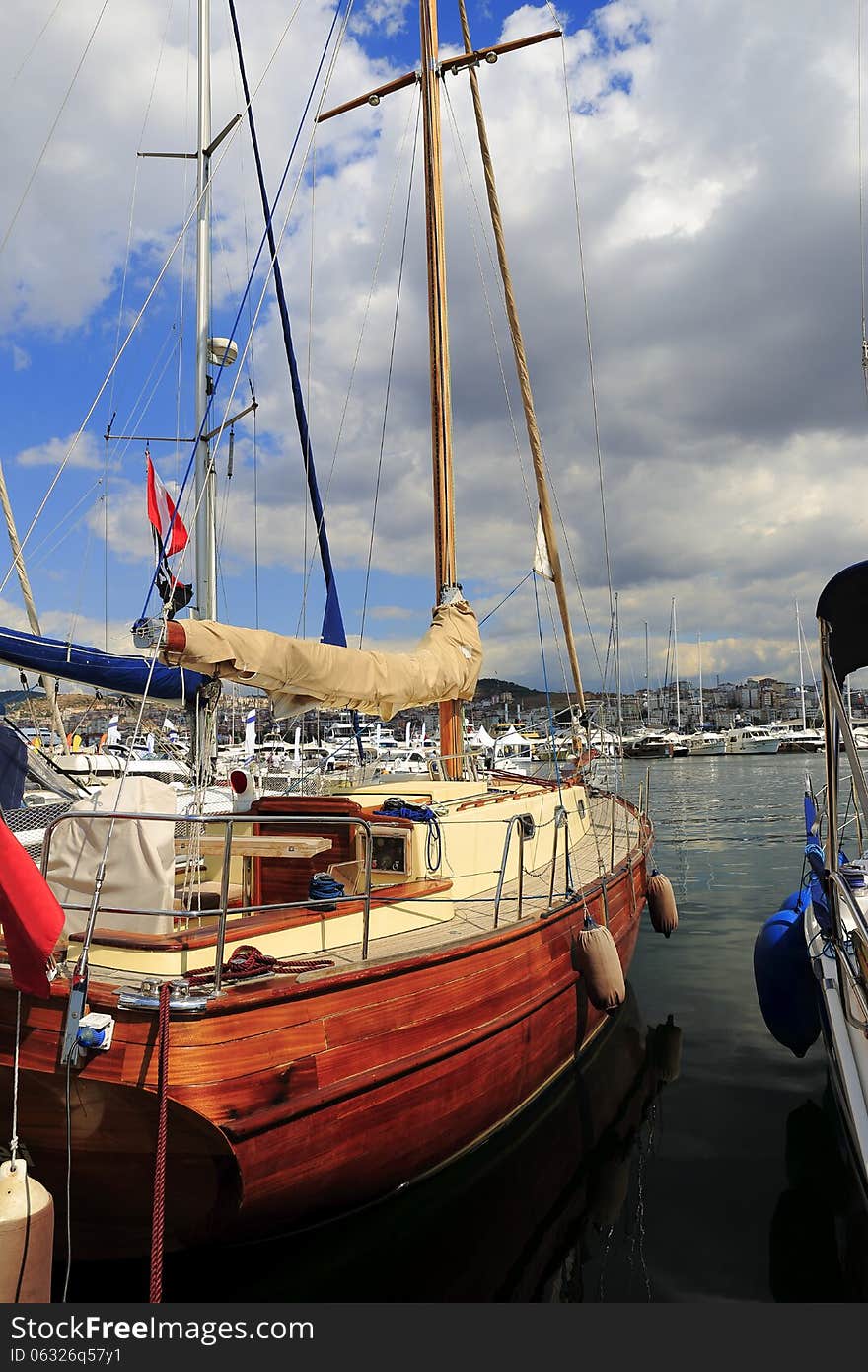 Moored on the waterfront, luxury wooden sailboat