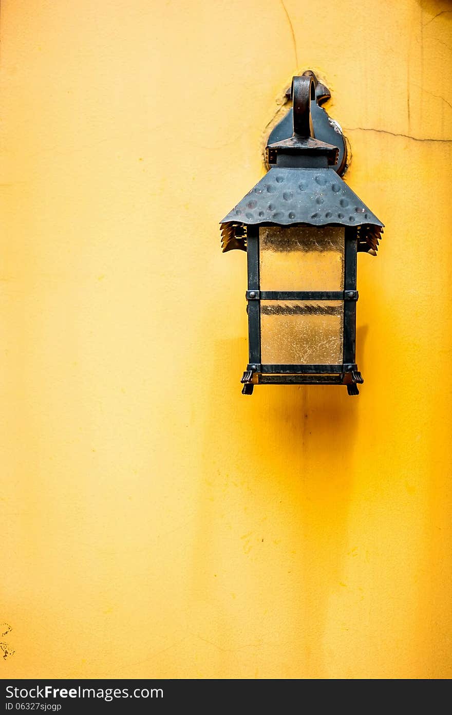 Vintage Lamp on yellow wall .