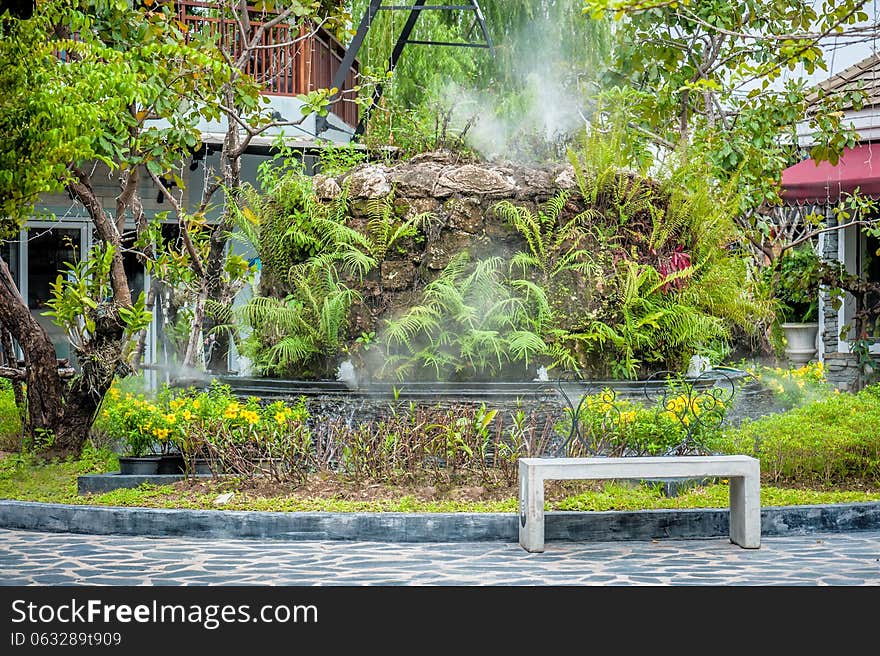 Stone chair in Garden with steam