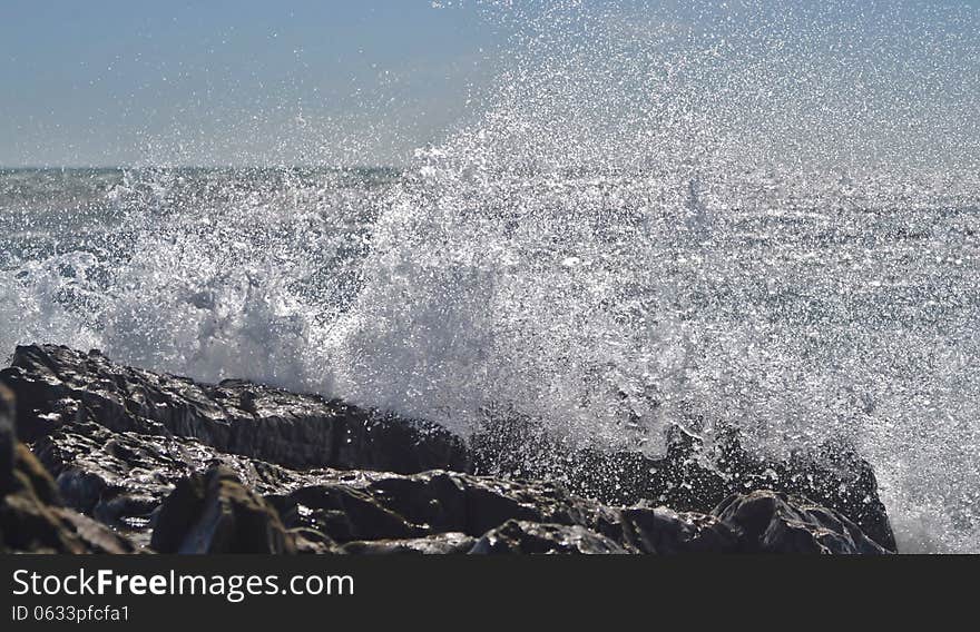 Landscape with waves crashing agains rocks. Landscape with waves crashing agains rocks