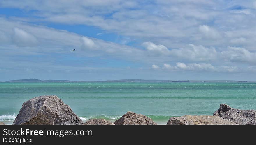 Landscape of Langebaan Lagoon with ganite rocks on the beach