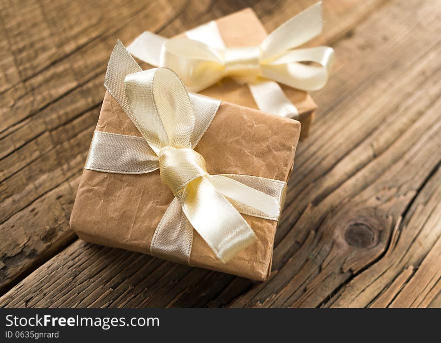 Gift boxes on old wooden background