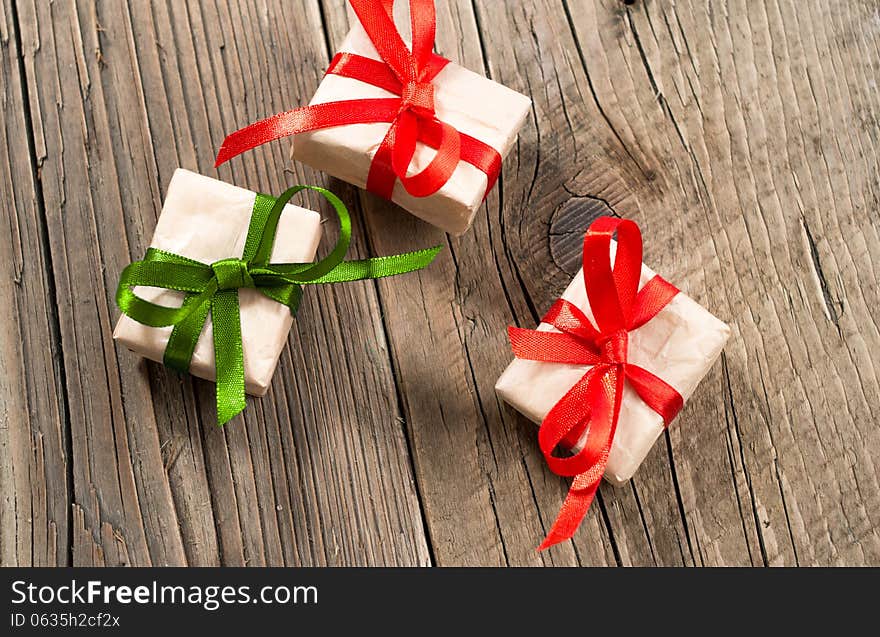 Gift boxes on old wooden background