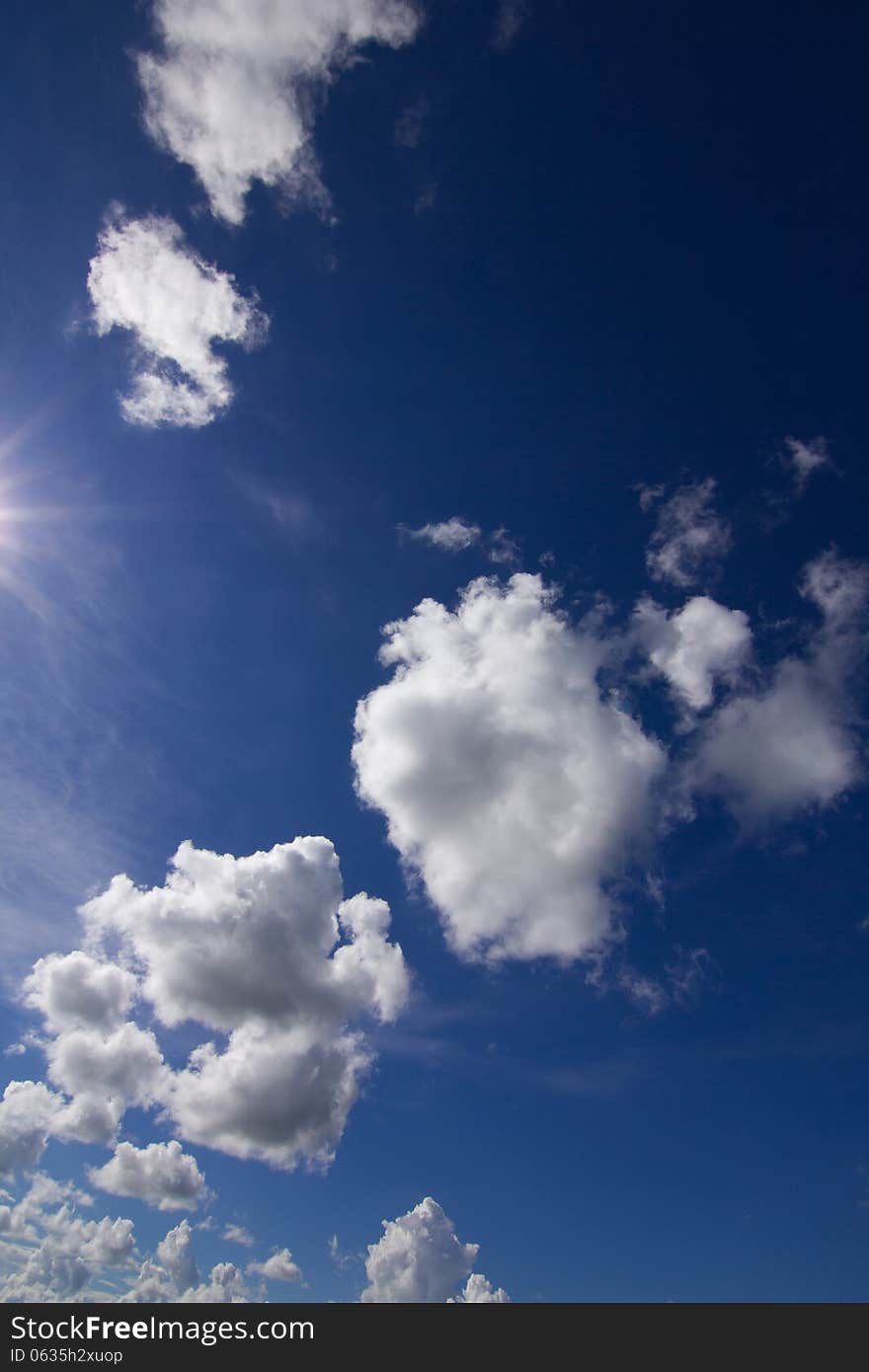 Blue sky with clouds and sun. Blue sky with clouds and sun