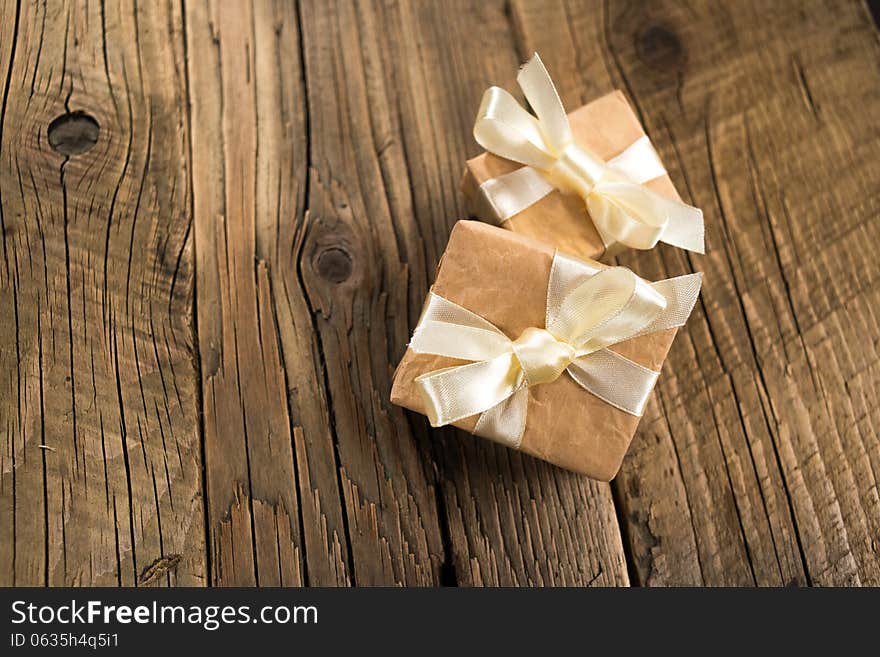 Gift boxes on old wooden background