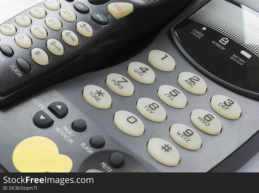 Part of black modern wireless telephone closeup. Part of black modern wireless telephone closeup