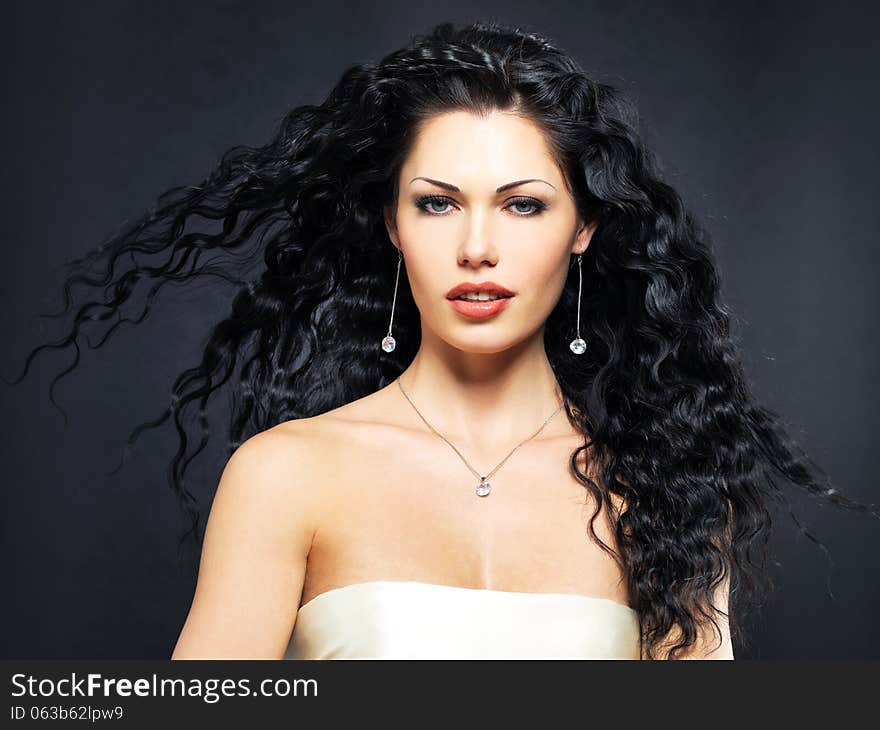 Beautiful fashion woman with curly hairstyle