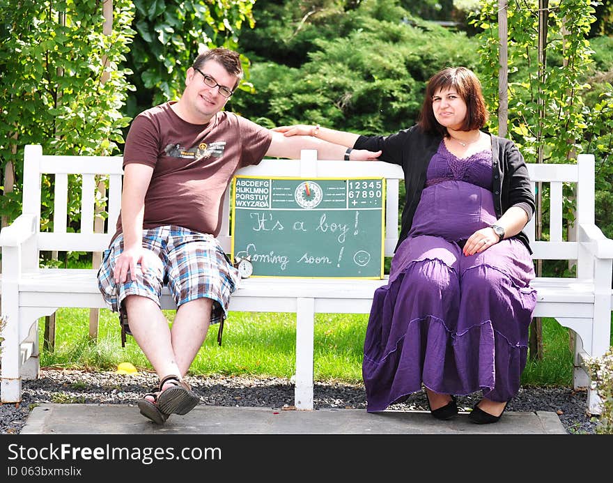 Happy pregnant women with her husband in the park. Happy pregnant women with her husband in the park.