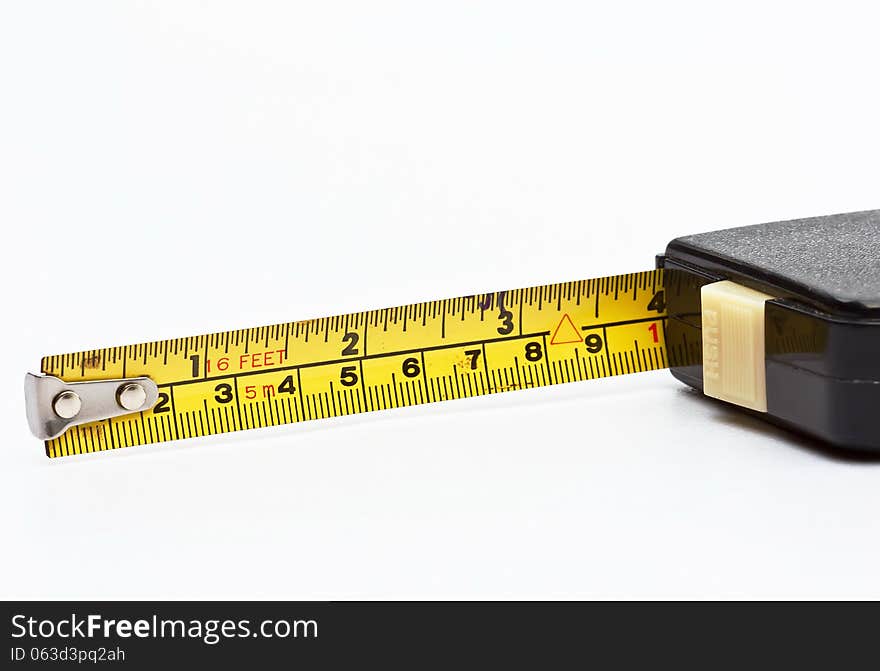 The old tape measure on white background. The old tape measure on white background.