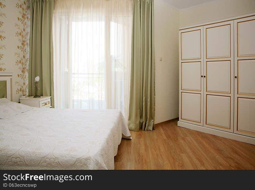 Antique style decorated bedroom interior