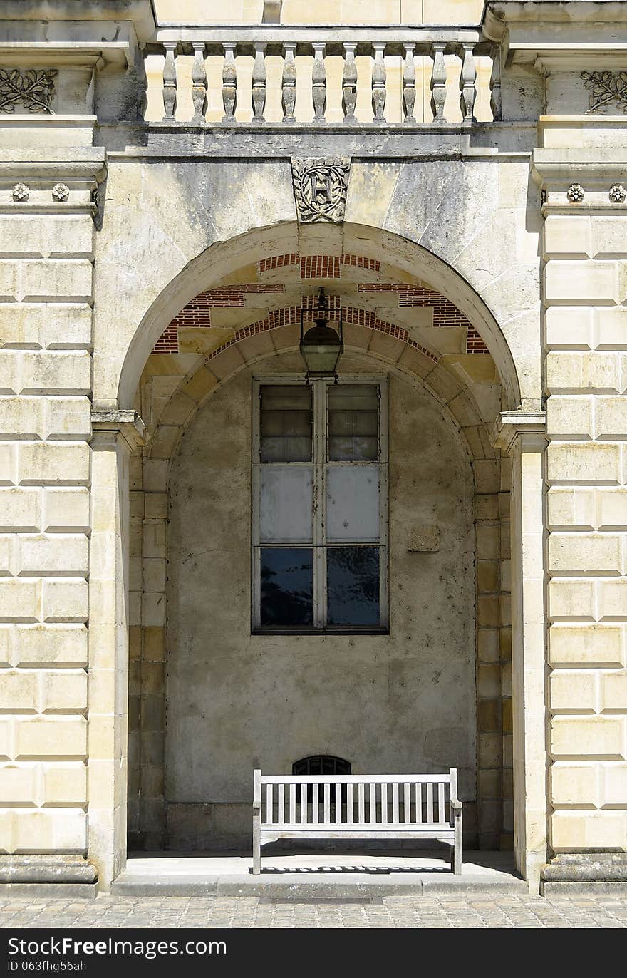 Bench under an arch. Detail of the castle Fontanebleau in France